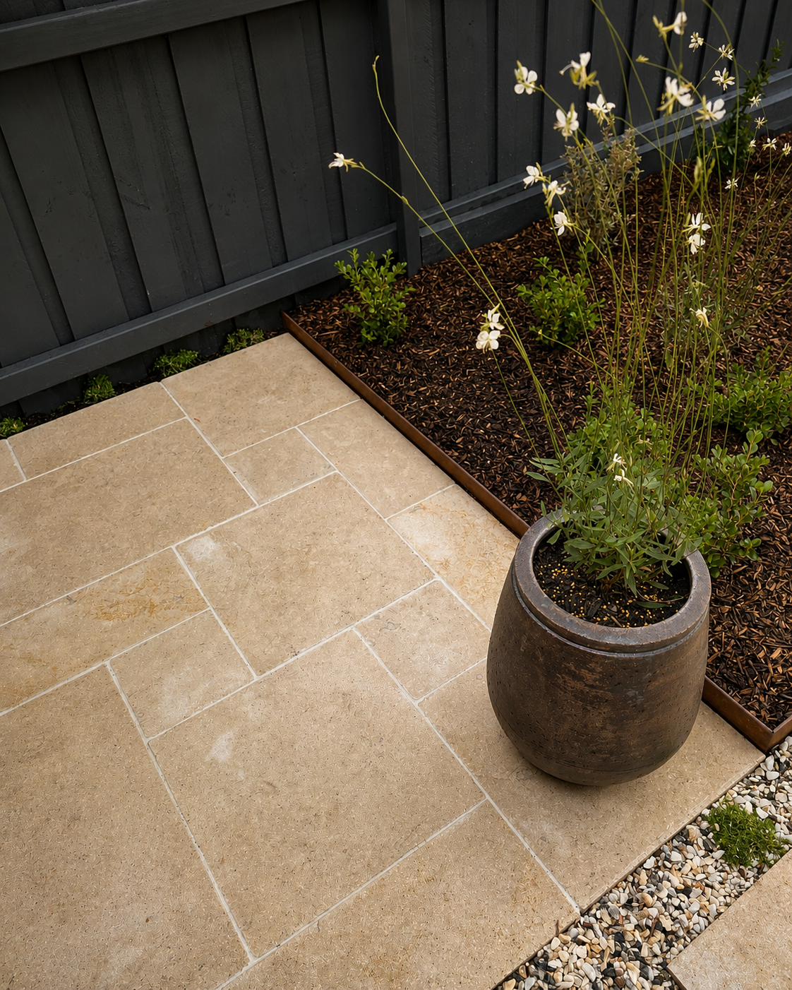 Heritage cottage entry with limestone path, ceramic pots and mature tree
